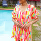 Eyes On You Coral & Yellow Geo Abstract Surplice Woven Romper