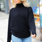 Lady In Black Ribbed Turtleneck Dolman Sweater