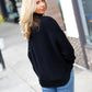 Lady In Black Ribbed Turtleneck Dolman Sweater