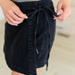 Bentli High Rise Side Tie Denim Skort in Black