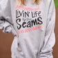 Livin’ Life By The Seams Sweatshirt